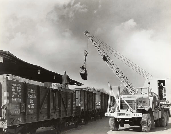 Airmen Loading Railcars Using a Crane on a Truck During ?
