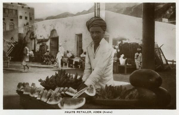 Fruit seller in street market, Aden