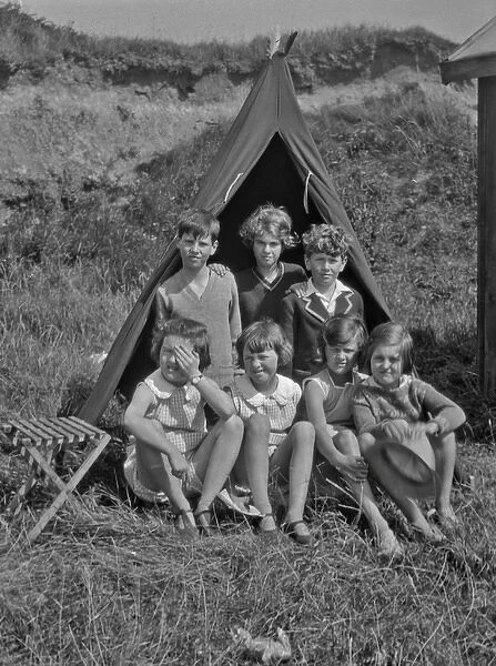 Group of children camping in a field