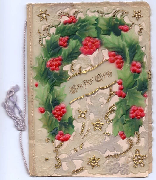 Holly and gold stars on an ornate Christmas card