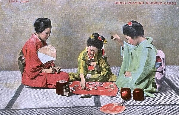 Japanese Geisha Girls playing a game of flower cards