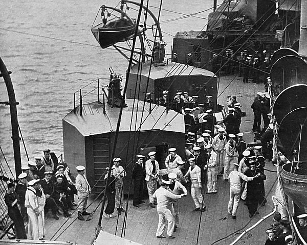 Sailors dancing to ships band on deck, WW1