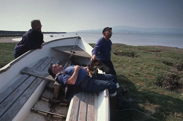 Three senior men at leisure on the coast at Askam, nr Barrow