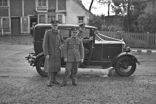Three soldiers with a car