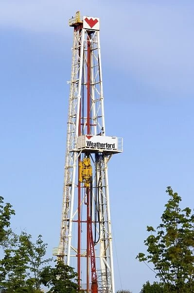 An oil-rig drilling derrick