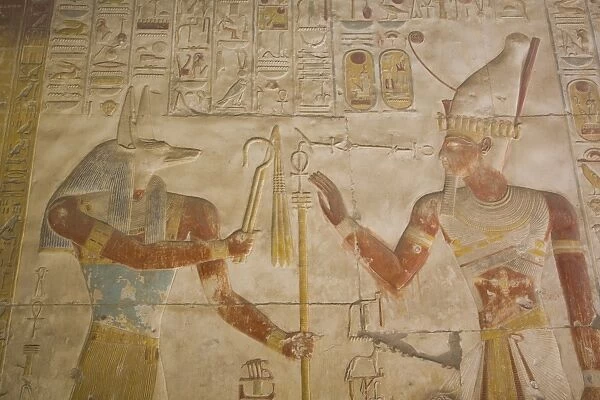 Bas-relief of the God Anubis on left and Ramses II on right, Temple of Seti I, Abydos
