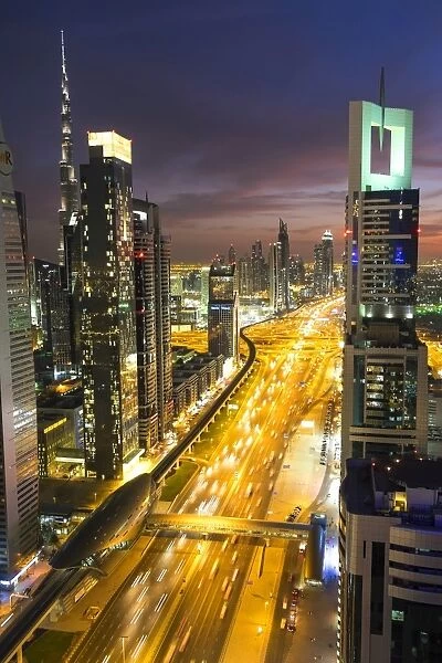 Elevated view at dusk over Downtown & Sheikh Zayed Road looking towards the Burj Kalifa, Dubai, United Arab Emirates, UAE