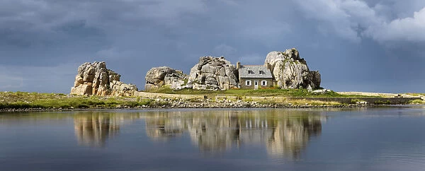 France, Brittany, Cote d armor, Plougrescant, Le Gouffre house reflected in lake