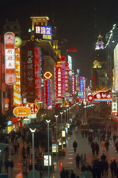 20012856. CHINA Shanghai Busy pedestrianised street with neon signs
