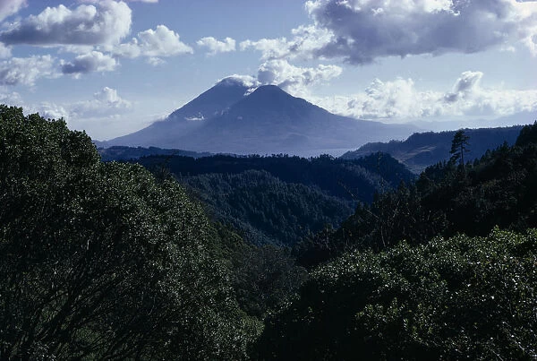 GUATEMALA, Lake Atitlan View across dense green rainforest towards Lake Atitlan