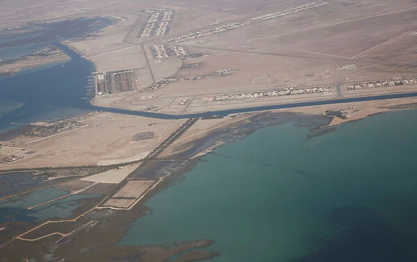 An aerial view of Arabian Gulf with city of Abu Dhabi is pictured through the window of