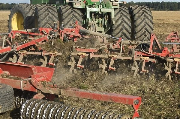 John Deere 9400 tractor, harrowing stubble field, Sweden