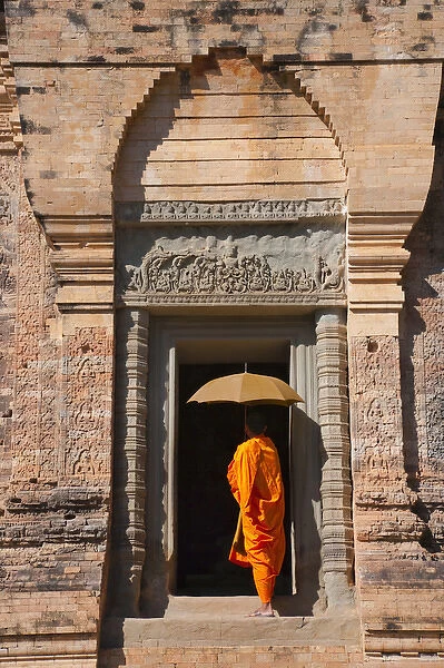 Monk in Prasat Kravan with brick structure, Angkor Wat, UNESCO World Heritage site