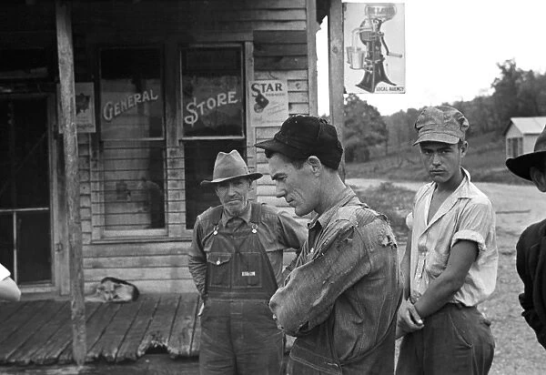 ARKANSAS: MINING TOWN. Unemployed miners standing in front of a closed general