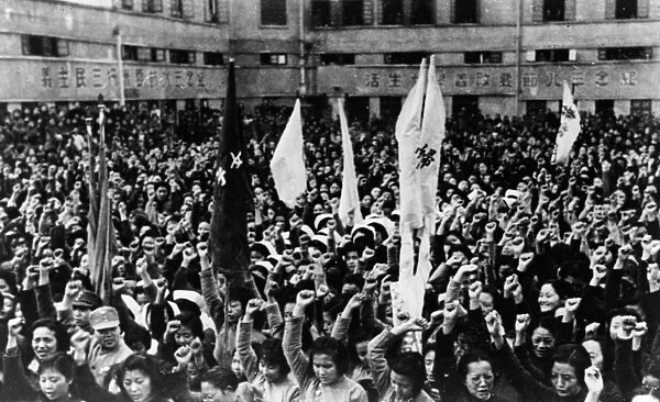 CHONGQING: WOMENs DAY. A crowd cheers during by a speech given by Soong Mei-ling
