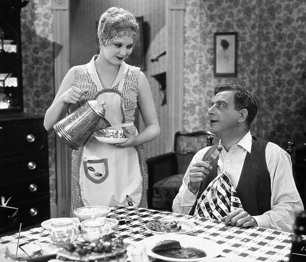 FILM STILL: EATING & DRINKING. Actors Thelma Todd and Milton Sills