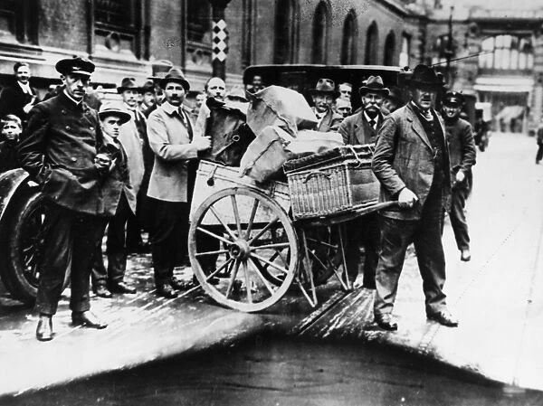 GERMANY: INFLATION, 1923. A large firms weekly payroll is transported from the