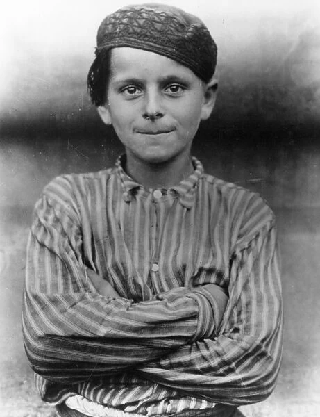 IMMIGRANTS: ELLIS ISLAND. An immigrant boy at Ellis Island, c1900