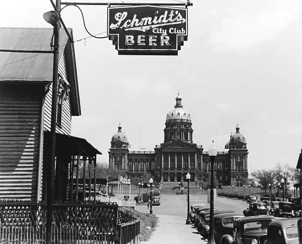 IOWA: DES MOINES, 1940. A bar and the Iowa State Capitol in Des Moines. Photograph by John Vachon