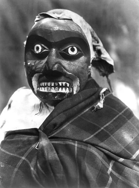 KWAKIUTL DANCER, c1914. A Kwakiutl dancer wearing a mask portraying a mythological