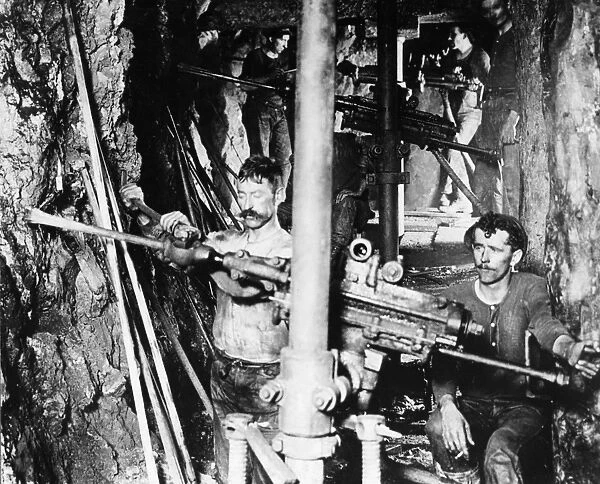 MONTANA: MINING, c1900. Miners operating drills in a mine in Butte, Montana. Photograph by N