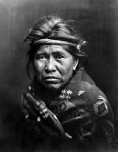NAVAJO MAN, c1914. Portrait of a Navajo man wrapped in a blanket. Photograph, c1914