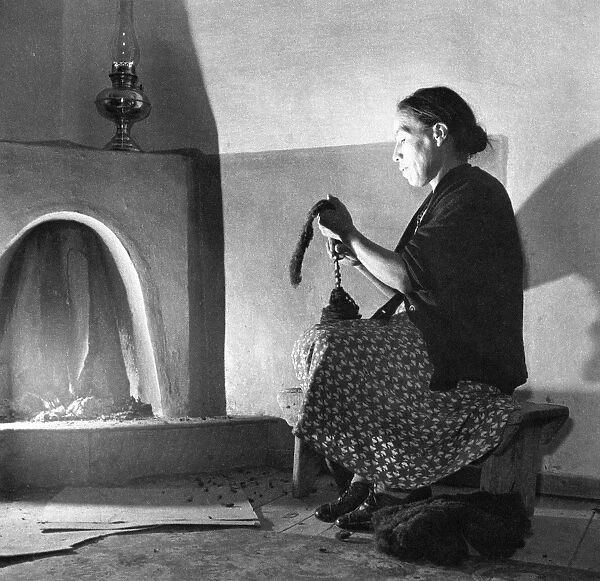 NEW MEXICO: SPINNING, 1943. Maclovia Lopez, wife of Mayor Juan Lopez of Trampas
