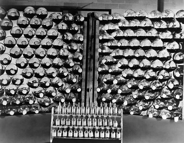 PENICILLIN, c1942. Ampoules of pencillin and racks of culture bottles used in its production
