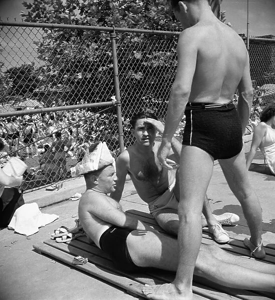 SWIMMING POOL, 1942. Men at a municipal swimming pool in Washington, D