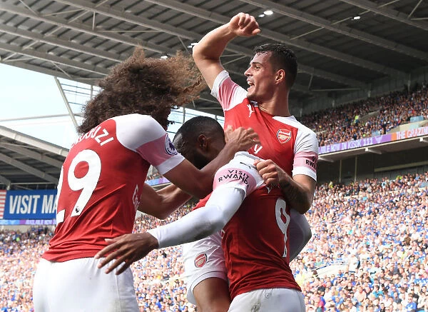 Arsenal's Xhaka, Lacazette, and Guendouzi Celebrate Goals Against Cardiff City