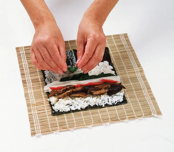 1 - Place a lightly toasted nori sheet on a bamboo mat