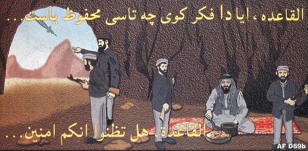 Afghanistan: Four armed men in cave, a fifth seated on rug eating. Man at mouth of