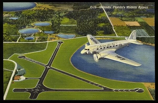 Airliner Above Municipal Airport. ca. 1939, Orlando, Florida, USA, O-19-Orlando, Floridas Modern Airport. Orlando Municipal Airport is the airline terminal of Central Florida and a favorite rendezvous of private flyers. Every modern aviation facility is available to the air traveler. The port is 200 acres in area