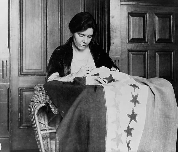 Alice Paul sewing suffrage flag