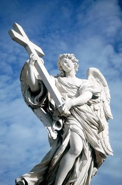 Angel carrying cross. From bridge opposite Castel St Angelo, Rome, Italy