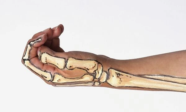 Arm with bone structure painted on skin