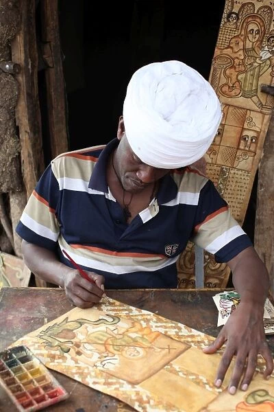 Artist painting religious themes in Lalibela