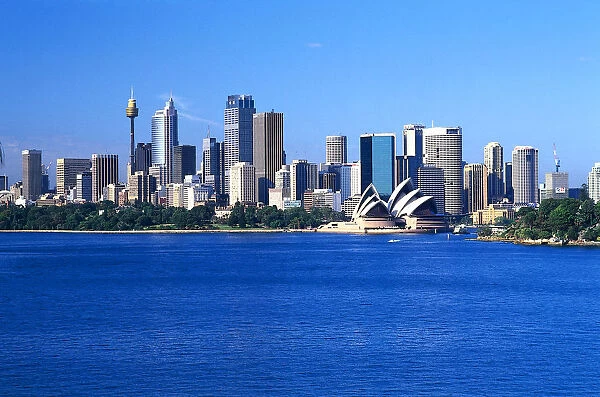 Australia, Sydney, city skyline from Garden Island to Farm Cove, seen across the water, showing skyscrapers and the Sydney Opera House