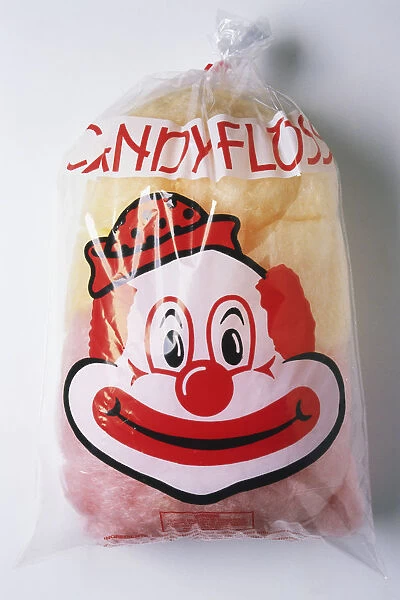 Bag of candyfloss with a clowns face on packaging