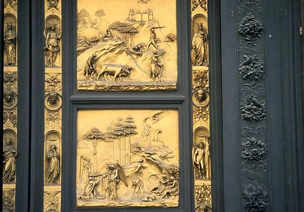 Baptistry building, Florence, Italy, showing two panels of the famous doors by Lorenzo Ghiberti