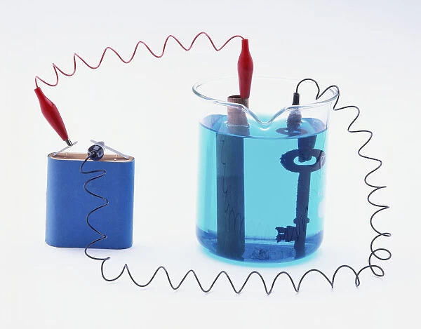Battery connected to a copper pipe and a key in copper sulphate solution, copper plating