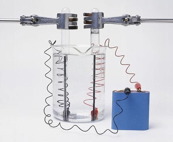 Battery connected to two electrodes in water for electrolysis