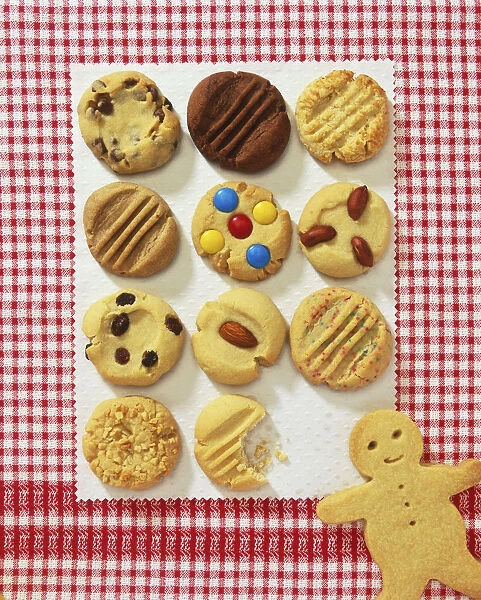 Biscuits and gingerbread man on checked background