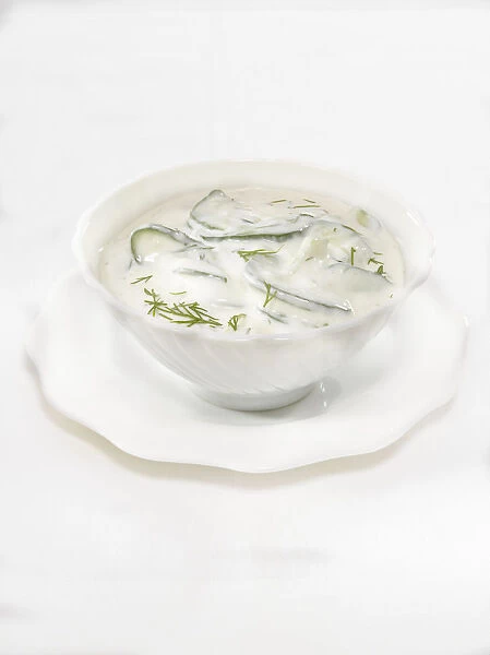 Bowl of cucumber and dill sauce made with mayonnaise and sour cream, close-up