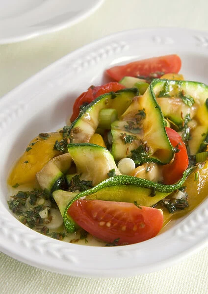 Bowl of grilled courgette salad, close-up