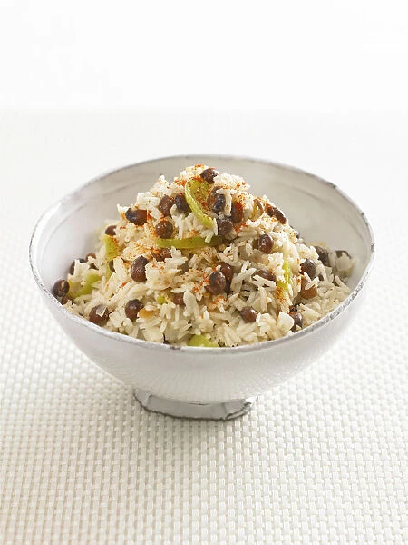 Bowl of rice with peas on white background, close-up