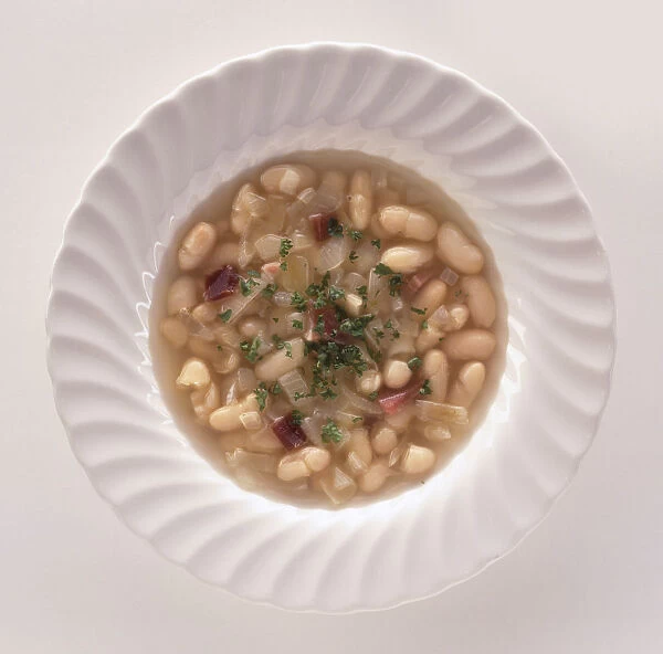 Bowl of Senate Bean Soup made with beans, onions and ham, a traditional dish from Washington DC, view from above
