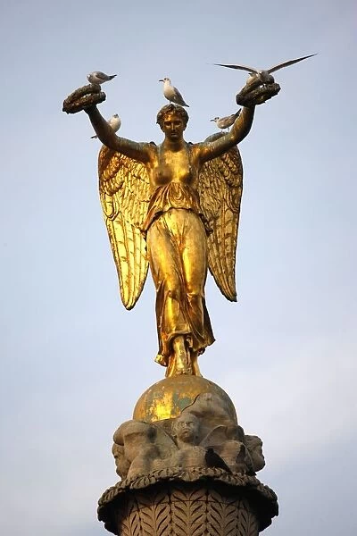 Chatelet column statue, angel holding two crowns, Paris, France