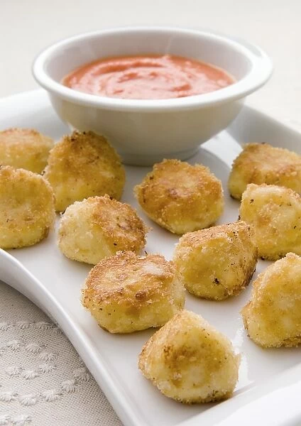 Cheese nuggets on tray, close-up