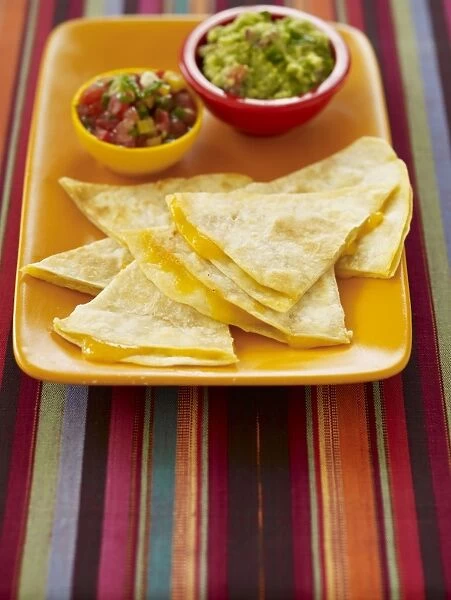 Cheese quesadillas with guacamole and salsa dips, close-up